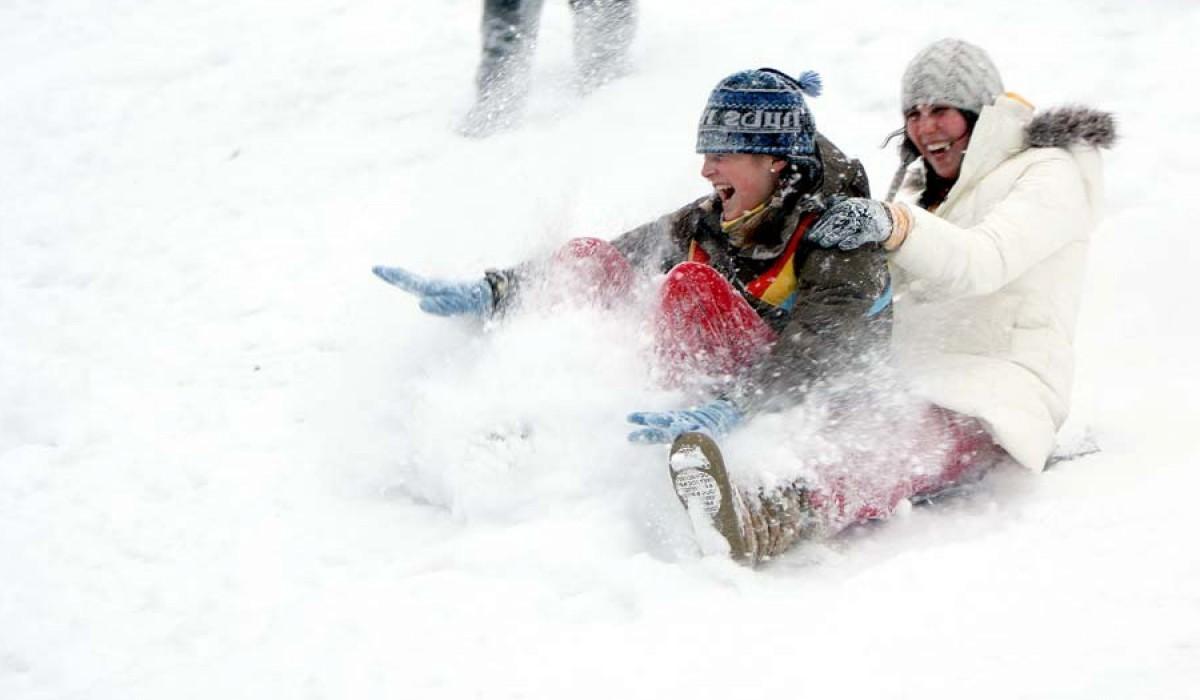 students sledding in Myers Hollow