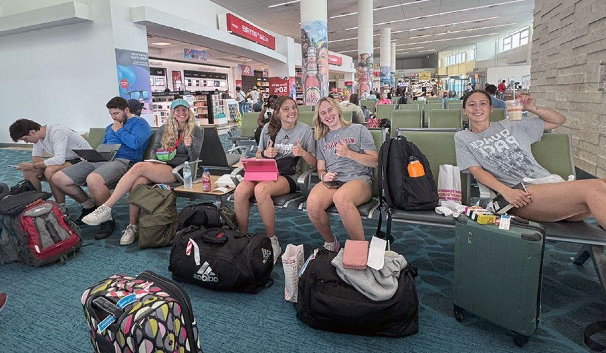 Happy students finally grabbing lunch in Nassau after a stressful morning in Charlotte