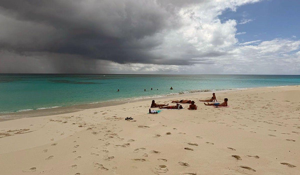 Clouds impinge on a beautiful beach day